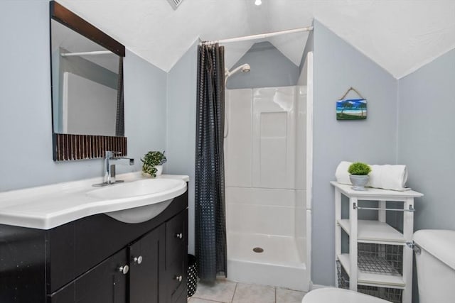 full bath featuring toilet, vaulted ceiling, a shower stall, tile patterned flooring, and vanity