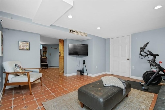 living area featuring recessed lighting and baseboards