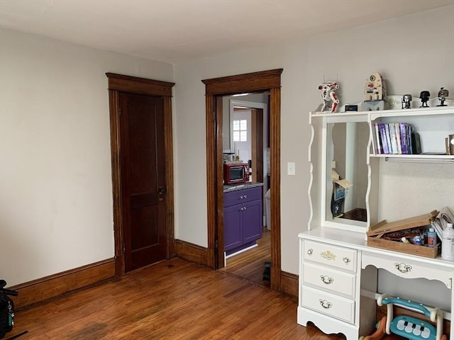 office space featuring wood finished floors and baseboards
