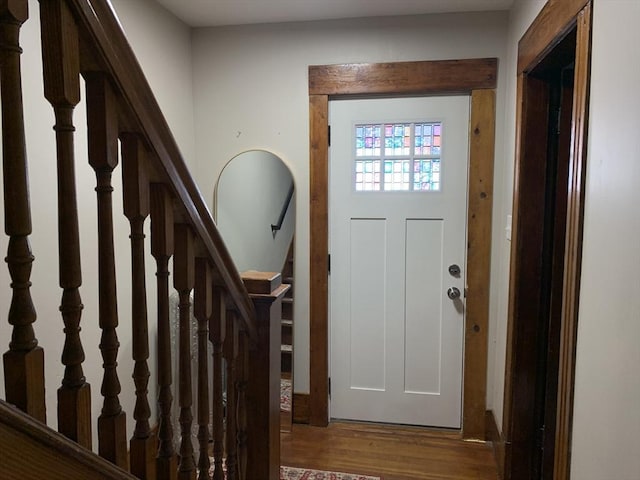 foyer entrance with wood finished floors and stairs