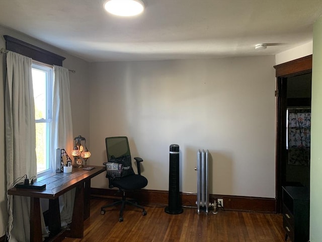 office space featuring wood finished floors and baseboards