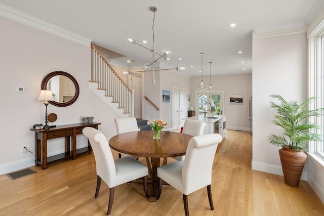 68 Summer St Unit B, Natick, MA 01760 - dining room with stairs, recessed lighting, light wood finished floors, ornamental molding, and baseboards