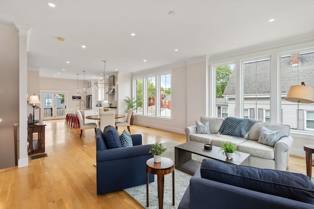 68 Summer St Unit B, Natick, MA 01760 - living room featuring healthy amount of natural light, ornamental molding, light wood finished floors, baseboards, and recessed lighting