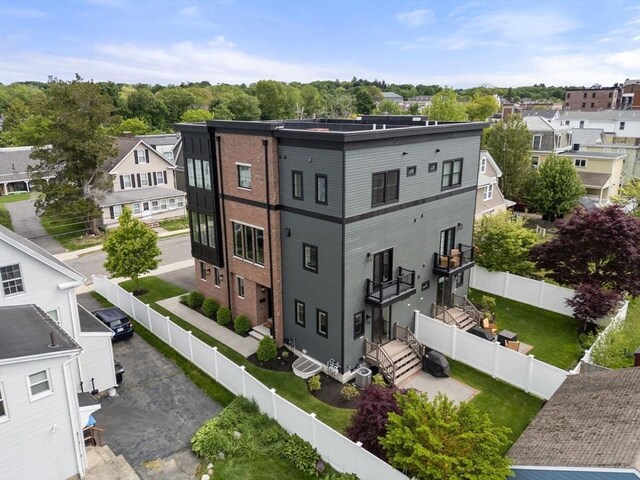 68 Summer St Unit B, Natick, MA 01760 - view of building exterior with a fenced backyard and a residential view