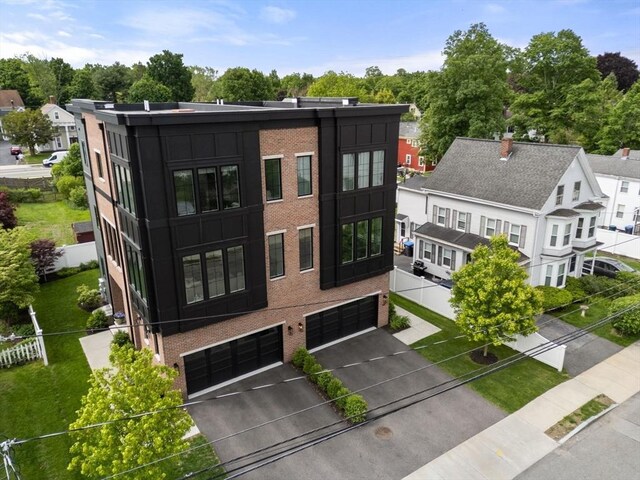 68 Summer St Unit B, Natick, MA 01760 - exterior space with an attached garage and driveway