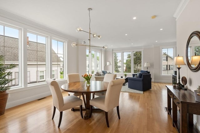 68 Summer St Unit B, Natick, MA 01760 - dining area featuring crown molding, a chandelier, light wood-style flooring, baseboards, and recessed lighting