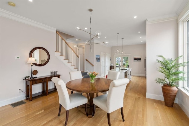 68 Summer St Unit B, Natick, MA 01760 - dining area featuring stairs, light wood-style floors, recessed lighting, baseboards, and crown molding