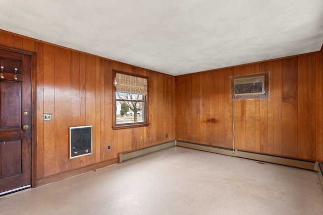 unfurnished room with wood walls and a wall mounted AC