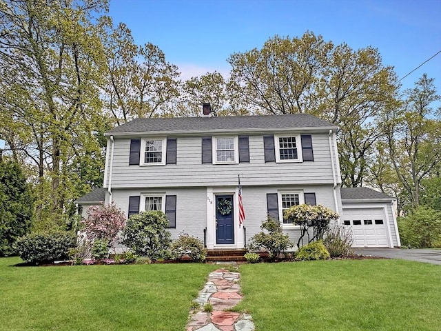 118 Academy Ave, Weymouth, MA 02188 - colonial-style house featuring driveway, a front yard, a chimney, and a detached garage