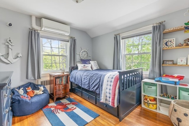 118 Academy Ave, Weymouth, MA 02188 - bedroom with lofted ceiling, multiple windows, wood finished floors, a wall mounted AC, and radiator heating unit
