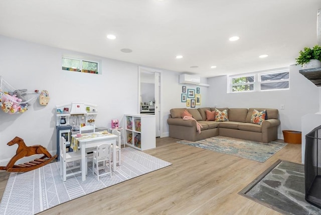 118 Academy Ave, Weymouth, MA 02188 - living area with wood finished floors, recessed lighting, a wall mounted AC, and baseboards