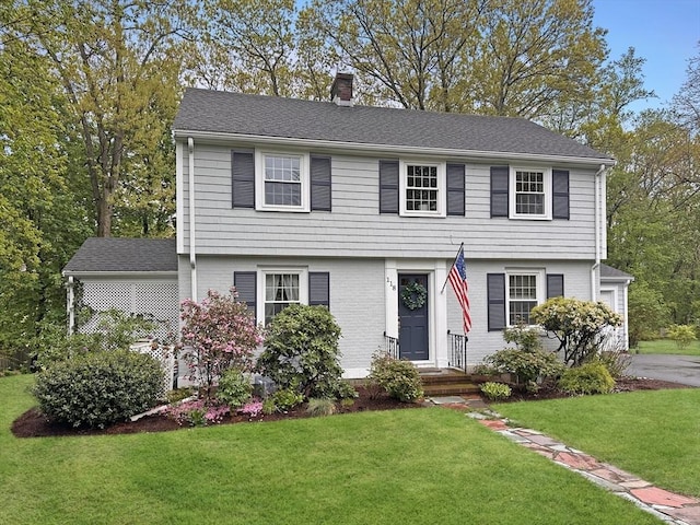 118 Academy Ave, Weymouth, MA 02188 - colonial-style house featuring a chimney and a front yard