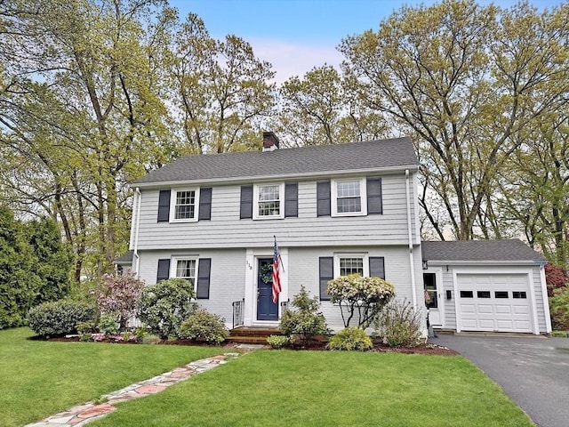 118 Academy Ave, Weymouth, MA 02188 - colonial-style house with an attached garage, a chimney, driveway, and a front yard
