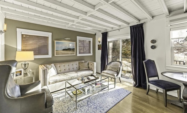 interior space with wooden ceiling, plenty of natural light, and beam ceiling