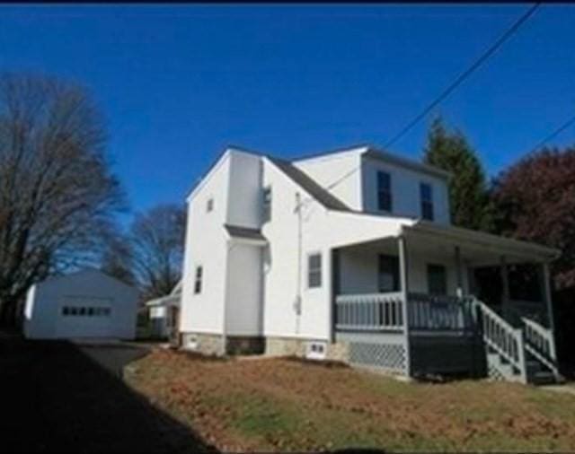 view of property exterior with covered porch