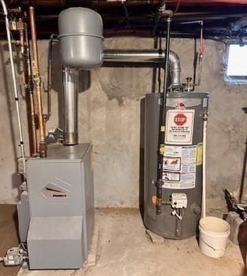 utility room with gas water heater