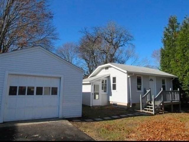 exterior space featuring an outbuilding and a garage