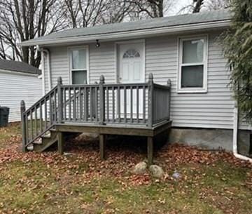 entrance to property with a wooden deck