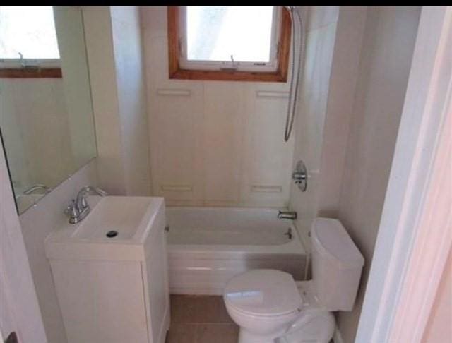 full bathroom with tile patterned flooring, vanity, toilet, and shower / tub combination