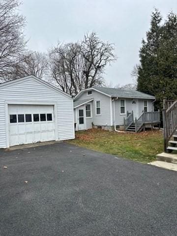 view of front of house with a deck and a garage