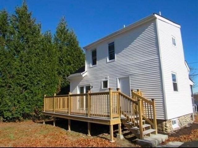 rear view of house with a wooden deck