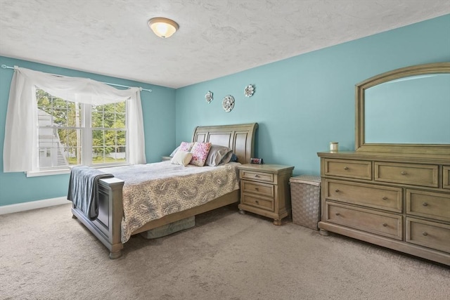41 Belmont Ave Unit 41, Haverhill, MA 01830 - bedroom featuring light carpet, a textured ceiling, and baseboards
