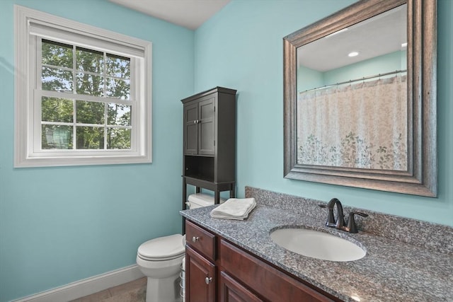 41 Belmont Ave Unit 41, Haverhill, MA 01830 - bathroom with vanity, toilet, baseboards, and tile patterned floors