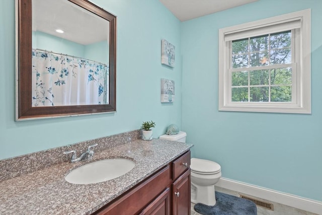41 Belmont Ave Unit 41, Haverhill, MA 01830 - bathroom featuring toilet, vanity, baseboards, and a shower with curtain