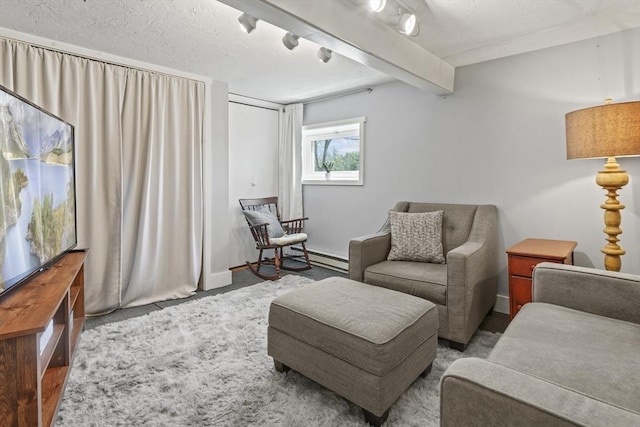 sitting room featuring baseboards and carpet flooring
