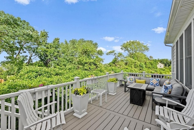 wooden deck featuring outdoor lounge area