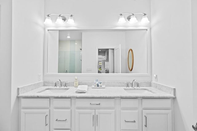 bathroom featuring vanity and an enclosed shower