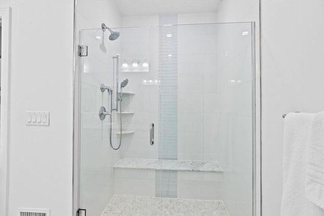 bathroom with an enclosed shower