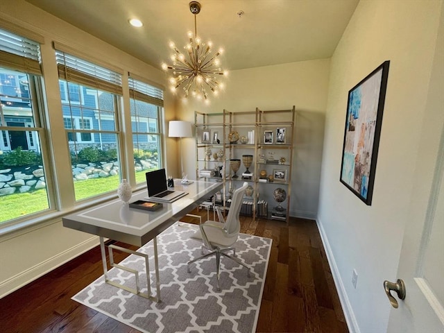 office featuring a healthy amount of sunlight, dark hardwood / wood-style flooring, and a chandelier