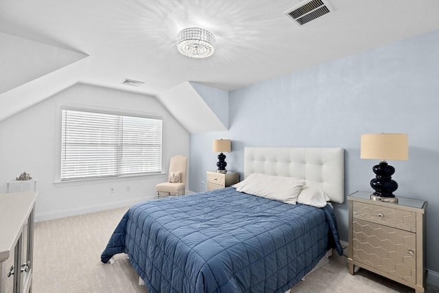 carpeted bedroom featuring a notable chandelier and vaulted ceiling