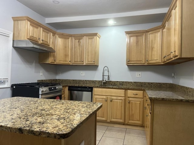 kitchen featuring light tile patterned flooring, appliances with stainless steel finishes, sink, dark stone counters, and kitchen peninsula