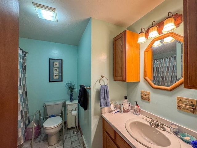 bathroom with toilet, a shower with shower curtain, a textured ceiling, and vanity