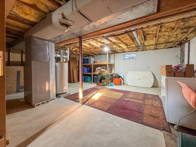 basement with heating unit, washer / dryer, and gas water heater