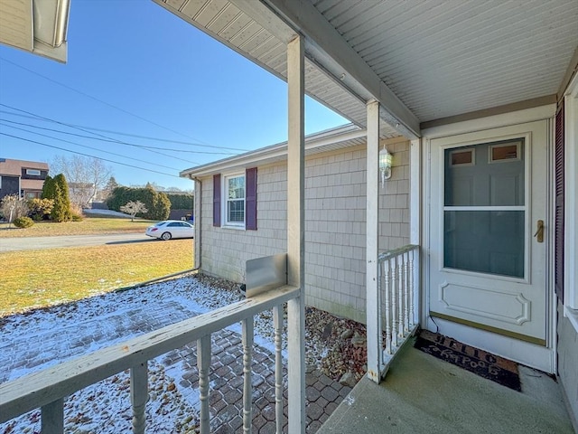 property entrance with covered porch