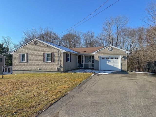 single story home featuring a garage and a front lawn