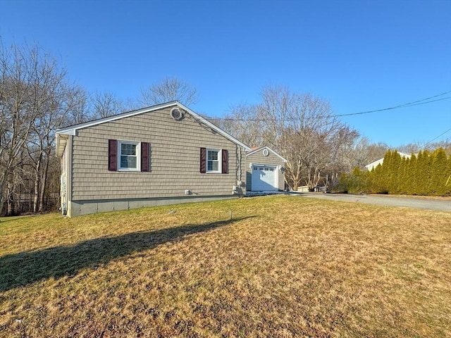 view of side of home featuring a yard