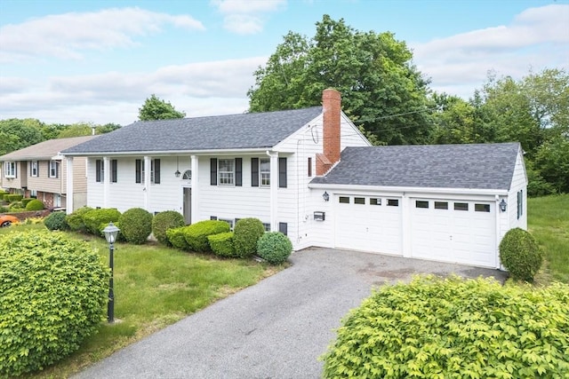 28 Marks Rd, Weymouth, MA 02189 - bi-level home with an attached garage, a chimney, asphalt driveway, roof with shingles, and a front lawn