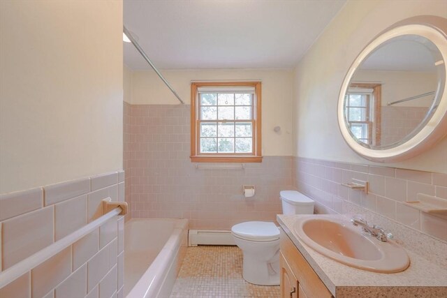 28 Marks Rd, Weymouth, MA 02189 - bathroom with tile walls, baseboard heating, tile patterned floors, vanity, and bathtub / shower combination
