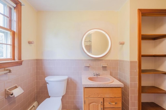 28 Marks Rd, Weymouth, MA 02189 - bathroom with tile walls, healthy amount of natural light, a wainscoted wall, toilet, and vanity