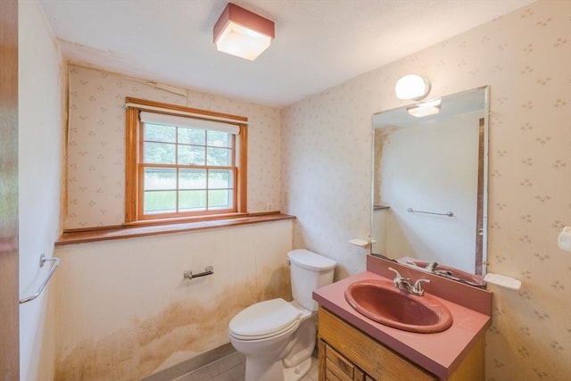 28 Marks Rd, Weymouth, MA 02189 - half bath featuring vanity, toilet, wallpapered walls, and tile patterned flooring