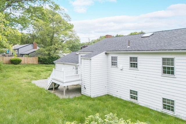 28 Marks Rd, Weymouth, MA 02189 - rear view of property with a wooden deck, a shingled roof, and a chimney