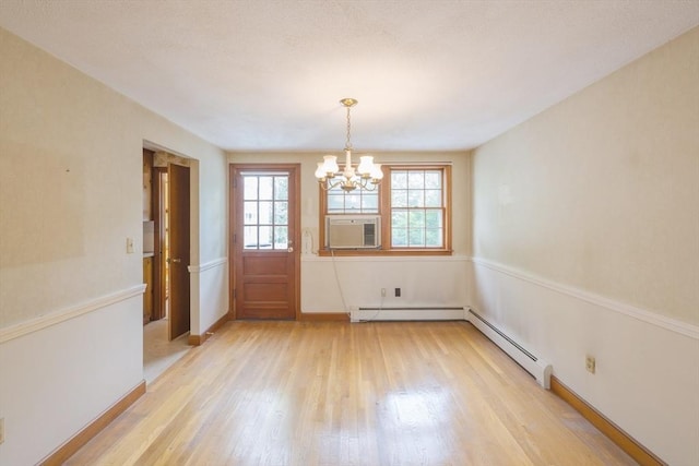 28 Marks Rd, Weymouth, MA 02189 - unfurnished dining area featuring a chandelier, light wood finished floors, cooling unit, a baseboard heating unit, and baseboards