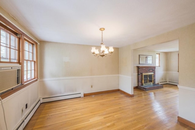 28 Marks Rd, Weymouth, MA 02189 - unfurnished living room with healthy amount of natural light, a chandelier, baseboard heating, and light wood-style flooring