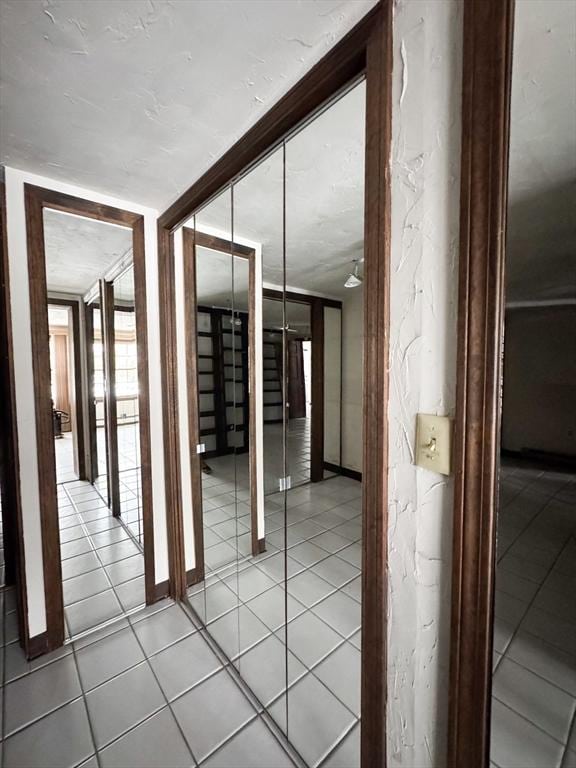 hall featuring tile patterned floors