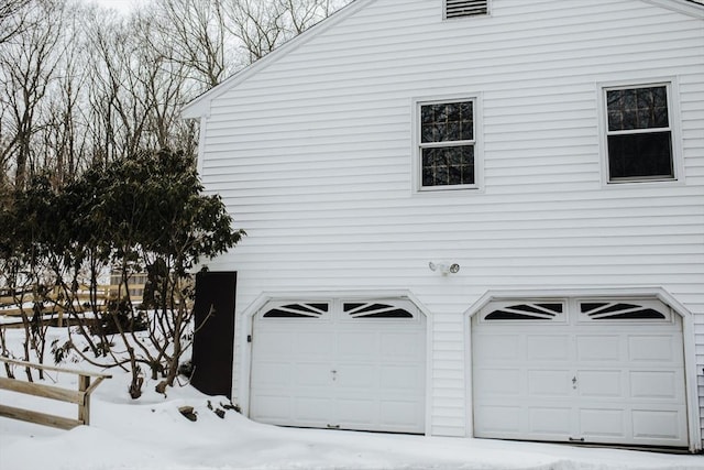 view of snow covered garage