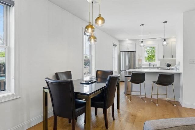9 Boston St Unit 3, Salem, MA 01970 - dining space featuring light wood-type flooring and baseboards